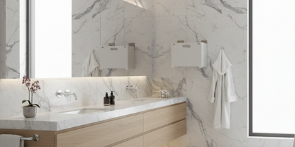 Modern bathroom with marble walls, a freestanding bathtub, and wooden vanity.