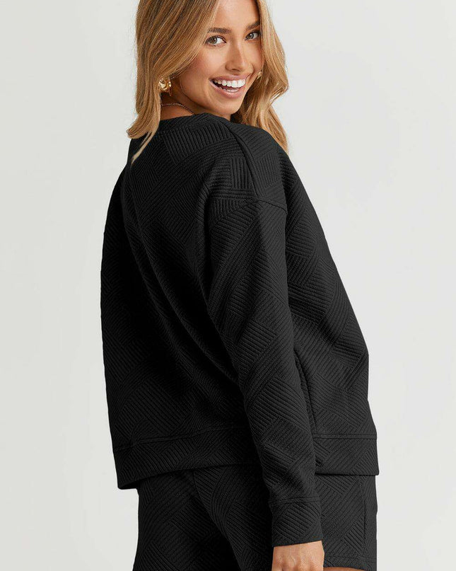Sophisticated Black Textured Lounge Set with Long Sleeve Top and Adjustable Shorts