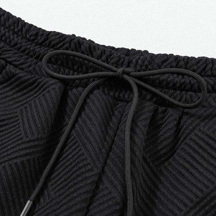 Sophisticated Black Textured Lounge Set with Long Sleeve Top and Adjustable Shorts