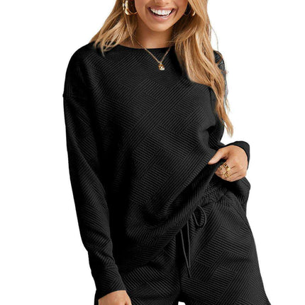 Sophisticated Black Textured Lounge Set with Long Sleeve Top and Adjustable Shorts