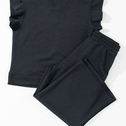 Chic Black Flutter Sleeve Top and Wide-Leg Trousers Ensemble