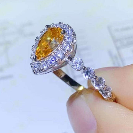 Timeless Teardrop Moissanite Ring with Sparkling Zircon Accents - A Blend of Elegance and Craftsmanship