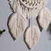 Nordic Serenity: Artisanal Cotton Tapestry with Wooden Bead Accents