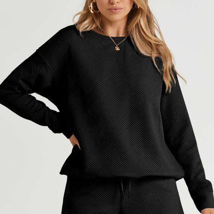 Sophisticated Black Textured Lounge Set with Long Sleeve Top and Adjustable Shorts