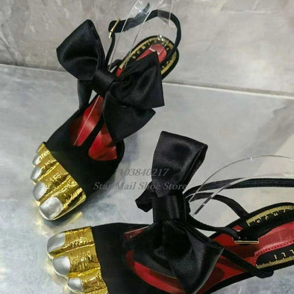 Chic Black High-Heeled Mules with Gold Highlights and Butterfly Bow Accent
