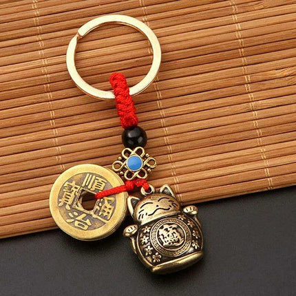 Brass Lucky Cat Keychain with Fortune Coin for Abundant Blessings.