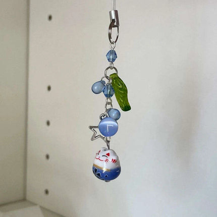 Charming Blue Cat Guardian Phone Accessory | Artisan Keychain with Leaf Detail - Très Elite