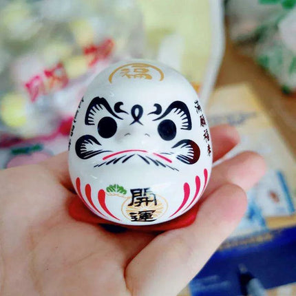 Charming Japanese Ceramic Lucky Cat Daruma Figurine for Home Decor and Gifting..