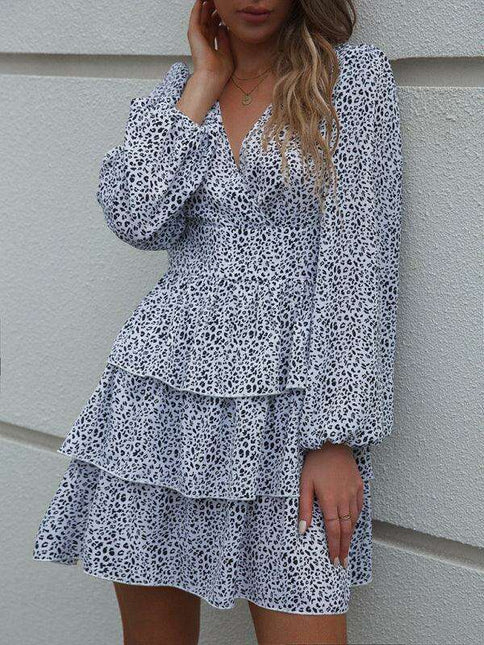 Charming Polka Dot V-Neck Dress with Puff Sleeves and Waist-Defining Style