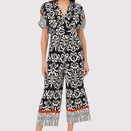 Chic Black and Cream Jumpsuit with Trendy Scoop Neck and Stylish Tie Back