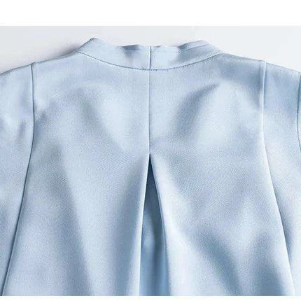 Chic Sleeveless Silk V-Neck Dress with Pleated Waistband Design..