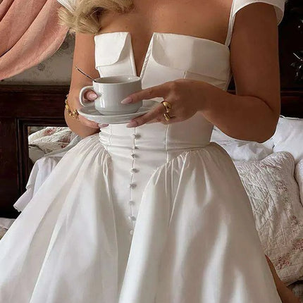 Chic White V-neck A-line Evening Gown with Stylish Button Embellishments and Flowy Pleats for Women - Très Elite