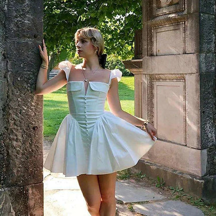 Chic White V-neck A-line Evening Gown with Stylish Button Embellishments and Flowy Pleats for Women - Très Elite