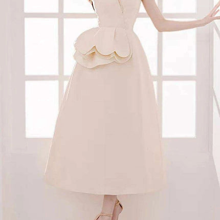 Elegant Apricot Velvet A-Line Slip Dress with Wave Hem Detail - Très Elite
