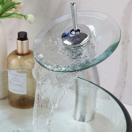 Elegant Blue Glass Vessel Sink Ensemble with Waterfall Faucet..