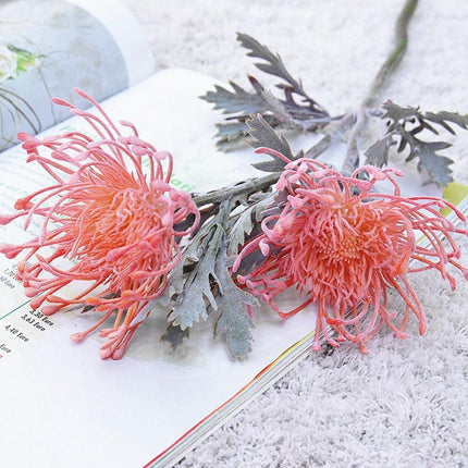 Elegant Crab Claw Floral Arrangement with Festive Garland Vase