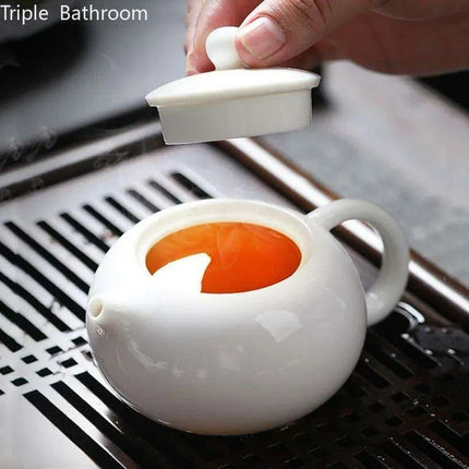 Elegant Dehua White Porcelain Teapot with Built-in Filter - Travel-Friendly Chinese Tea Set for Home and Adventure - Très Elite