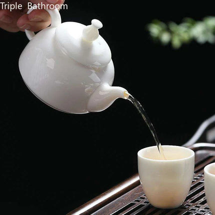 Elegant Dehua White Porcelain Teapot with Built-in Filter - Travel-Friendly Chinese Tea Set for Home and Adventure - Très Elite