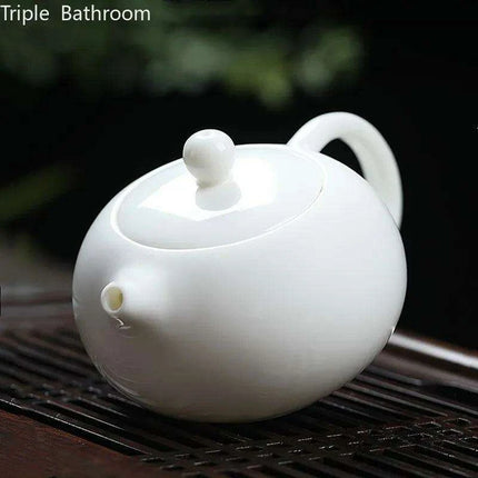 Elegant Dehua White Porcelain Teapot with Built-in Filter - Travel-Friendly Chinese Tea Set for Home and Adventure - Très Elite
