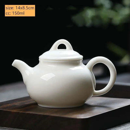 Elegant Dehua White Porcelain Teapot with Built-in Filter - Travel-Friendly Chinese Tea Set for Home and Adventure - Très Elite
