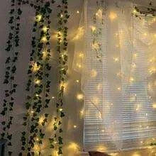 Ethereal Vine Wonderland: Premium Faux Rattan Garland with LED Illuminated Leaves - Très Elite