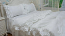 Sophisticated White Cotton Bedding Collection with Lace Detailing and Embroidered Trimmings