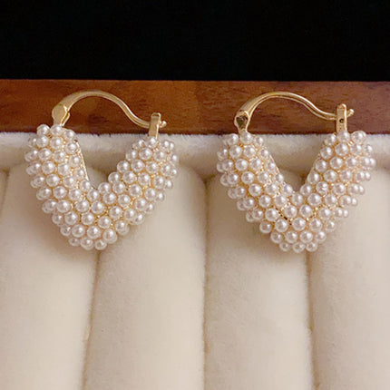 New sweet millet beads love heart sweet and cool niche design earrings. new-sweet-millet-beads-love-heart-sweet-and-cool-niche-design-earrings