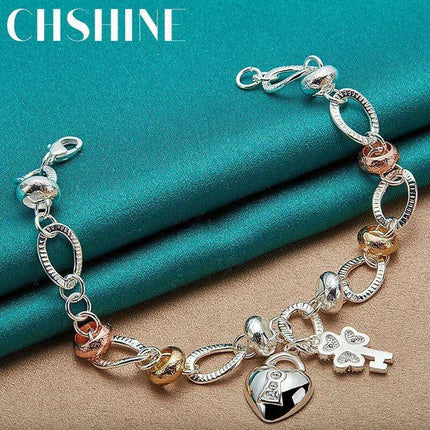 Radiant 925 Sterling Silver Heart Lock Clover Bracelet with Dazzling Zircon Stones - Très Elite