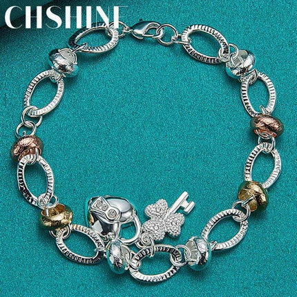 Radiant 925 Sterling Silver Heart Lock Clover Bracelet with Dazzling Zircon Stones - Très Elite