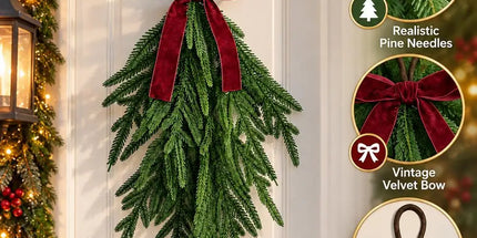Artificial Norfolk pine Christmas swag with red bow, hanging loop and close-up details on a door