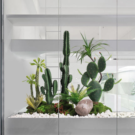 The Space Under The Staircase Is Decorated with Simulated Green Plants in The Desert Creating Indoor Micro-landscape the-space-under-the-staircase-is-decorated-with-simulated-green-plants-in-the-desert-creating-indoor-micro-landscape
