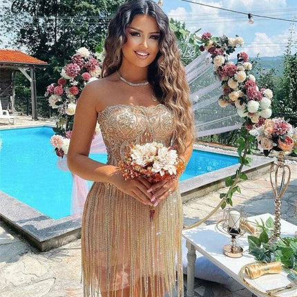 Elegant Champagne Strapless Gown with Crystal Accents and Trendy Tassels