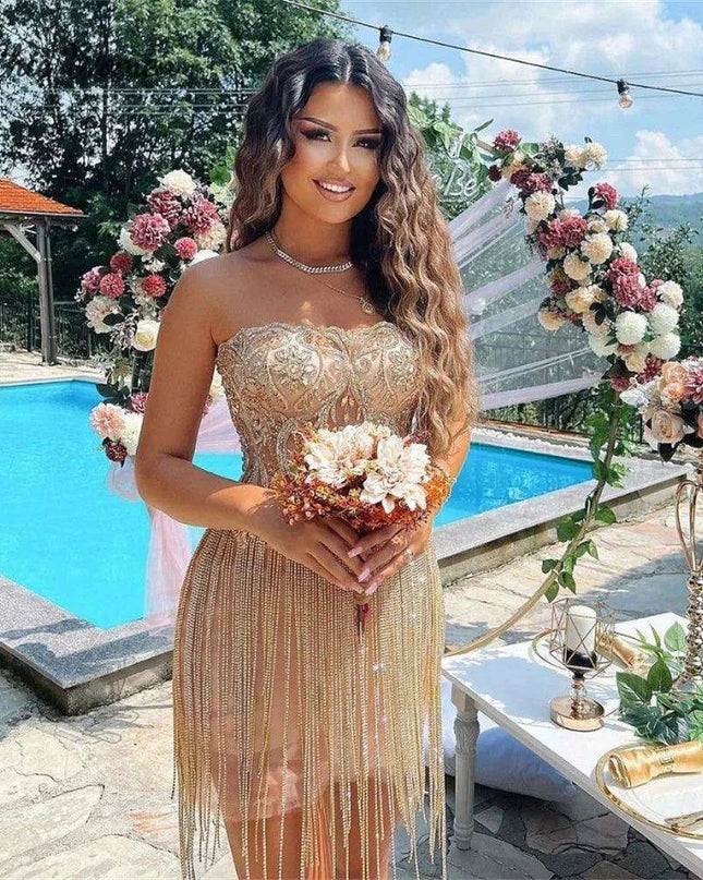 Elegant Champagne Strapless Gown with Crystal Accents and Trendy Tassels