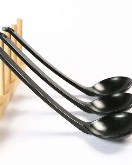 Sophisticated Black Melamine Serving Spoon with Elegant Japanese Porcelain Motif