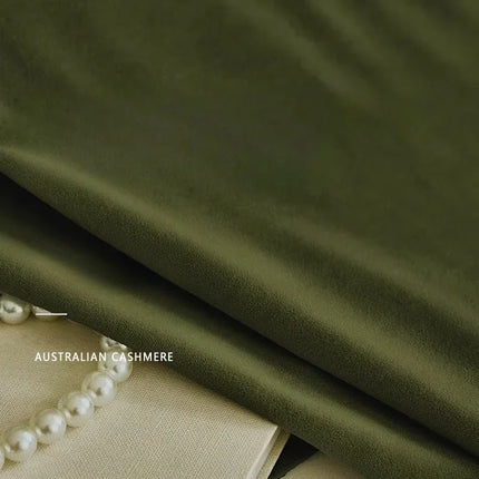 Close-up of olive green velvet fabric texture