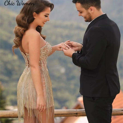 Elegant Champagne Strapless Gown with Crystal Accents and Trendy Tassels