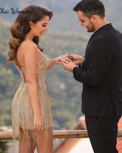 Elegant Champagne Strapless Gown with Crystal Accents and Trendy Tassels