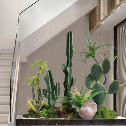 The Space Under The Staircase Is Decorated with Simulated Green Plants in The Desert Creating Indoor Micro-landscape the-space-under-the-staircase-is-decorated-with-simulated-green-plants-in-the-desert-creating-indoor-micro-landscape