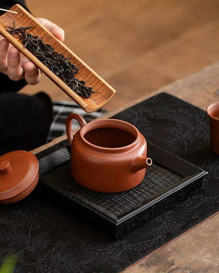 Authentic Artisan Yixing Purple Clay Teapot with Built-In Strainer for a Premium Puer Tea Experience