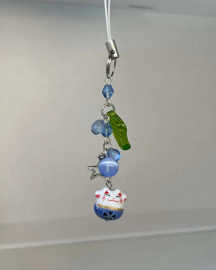 Charming Blue Cat Guardian Phone Accessory | Artisan Keychain with Leaf Detail