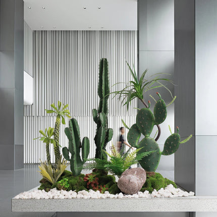 The Space Under The Staircase Is Decorated with Simulated Green Plants in The Desert Creating Indoor Micro-landscape the-space-under-the-staircase-is-decorated-with-simulated-green-plants-in-the-desert-creating-indoor-micro-landscape