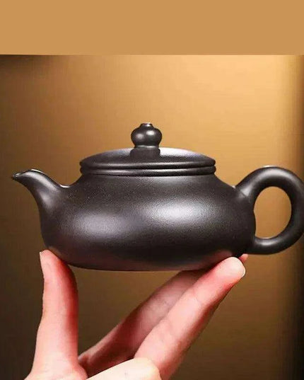 Handcrafted 140ml Yixing Purple Clay Teapot - Exquisite Zisha Kettle for Passionate Tea Aficionados