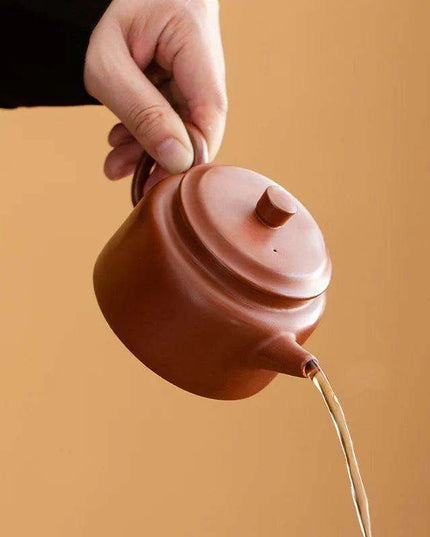 Authentic Artisan Yixing Purple Clay Teapot with Built-In Strainer for a Premium Puer Tea Experience