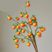 Festive Red Pomegranate Floral Branch with Lush Greenery