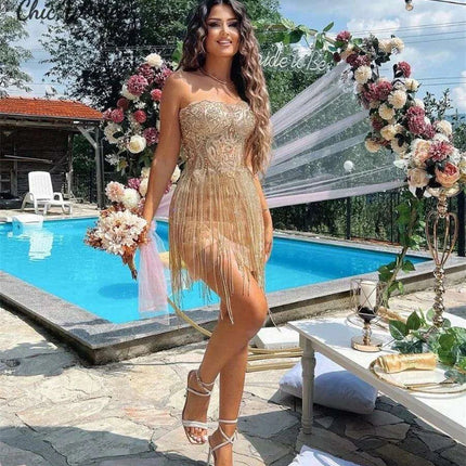 Elegant Champagne Strapless Gown with Crystal Accents and Trendy Tassels