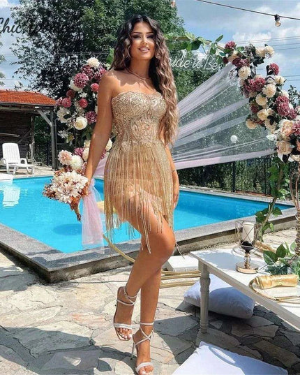 Elegant Champagne Strapless Gown with Crystal Accents and Trendy Tassels