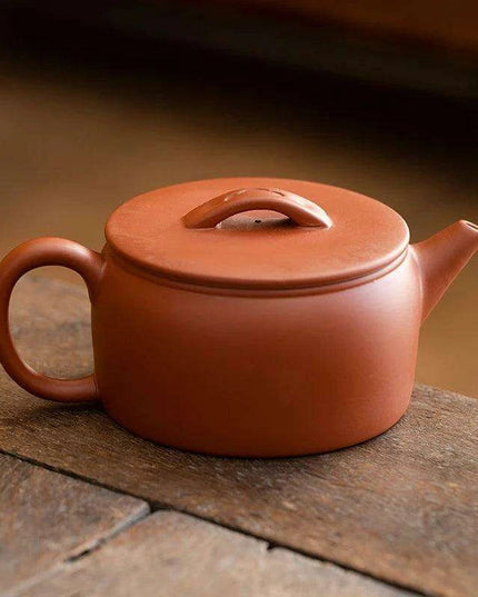 Authentic Artisan Yixing Purple Clay Teapot with Built-In Strainer for a Premium Puer Tea Experience