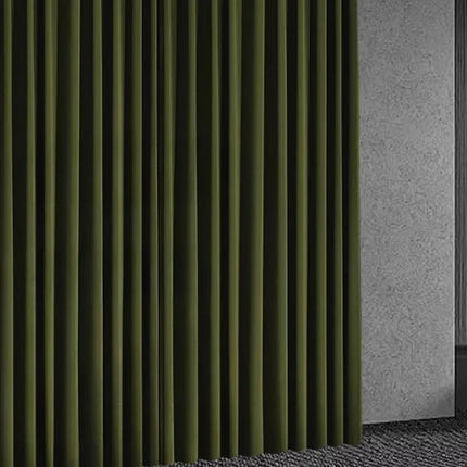 Floor-length olive green curtains beside a gray wall