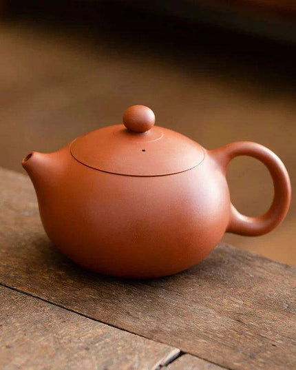 Authentic Artisan Yixing Purple Clay Teapot with Built-In Strainer for a Premium Puer Tea Experience