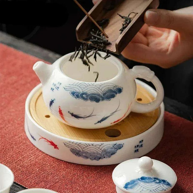 Artisan Xishi Tea Experience: Exquisite Hand-Painted Teapot Set with Premium Filter